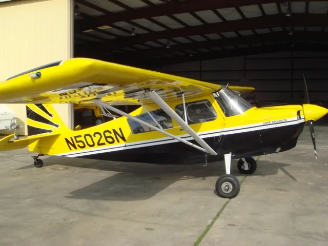 Yellow Decathlon N5026N aircraft outside hangar