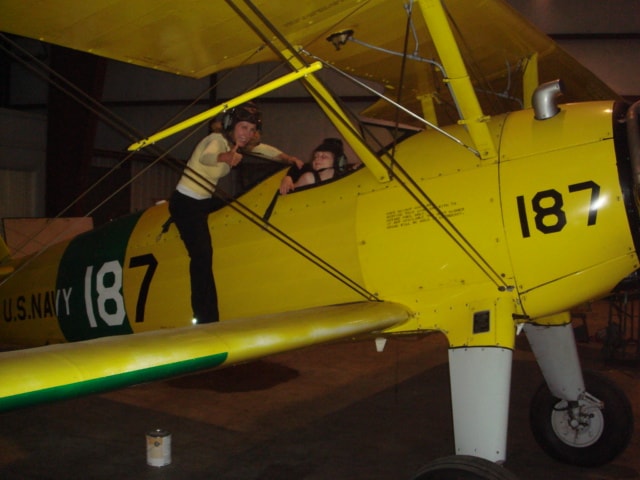 U.S. Navy 187 Stearman with two people in the cockpit